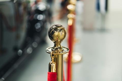 Gold stanchion with red velvet rope